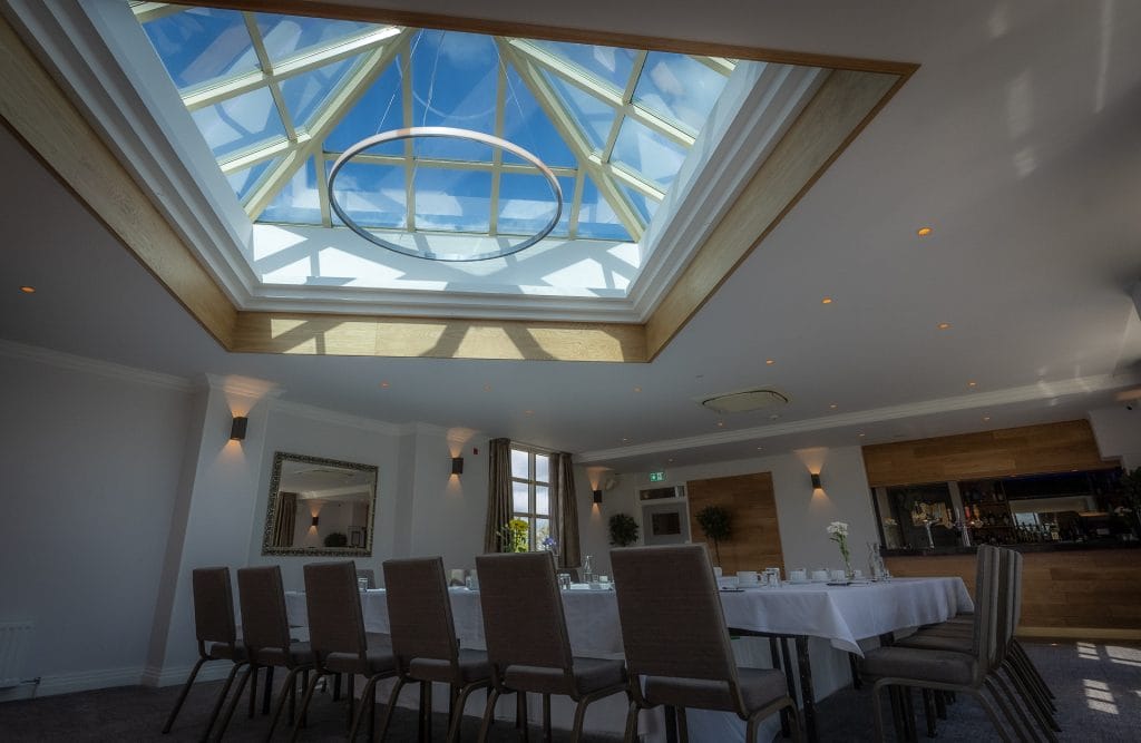 wake venue with skylight in a large room with chairs